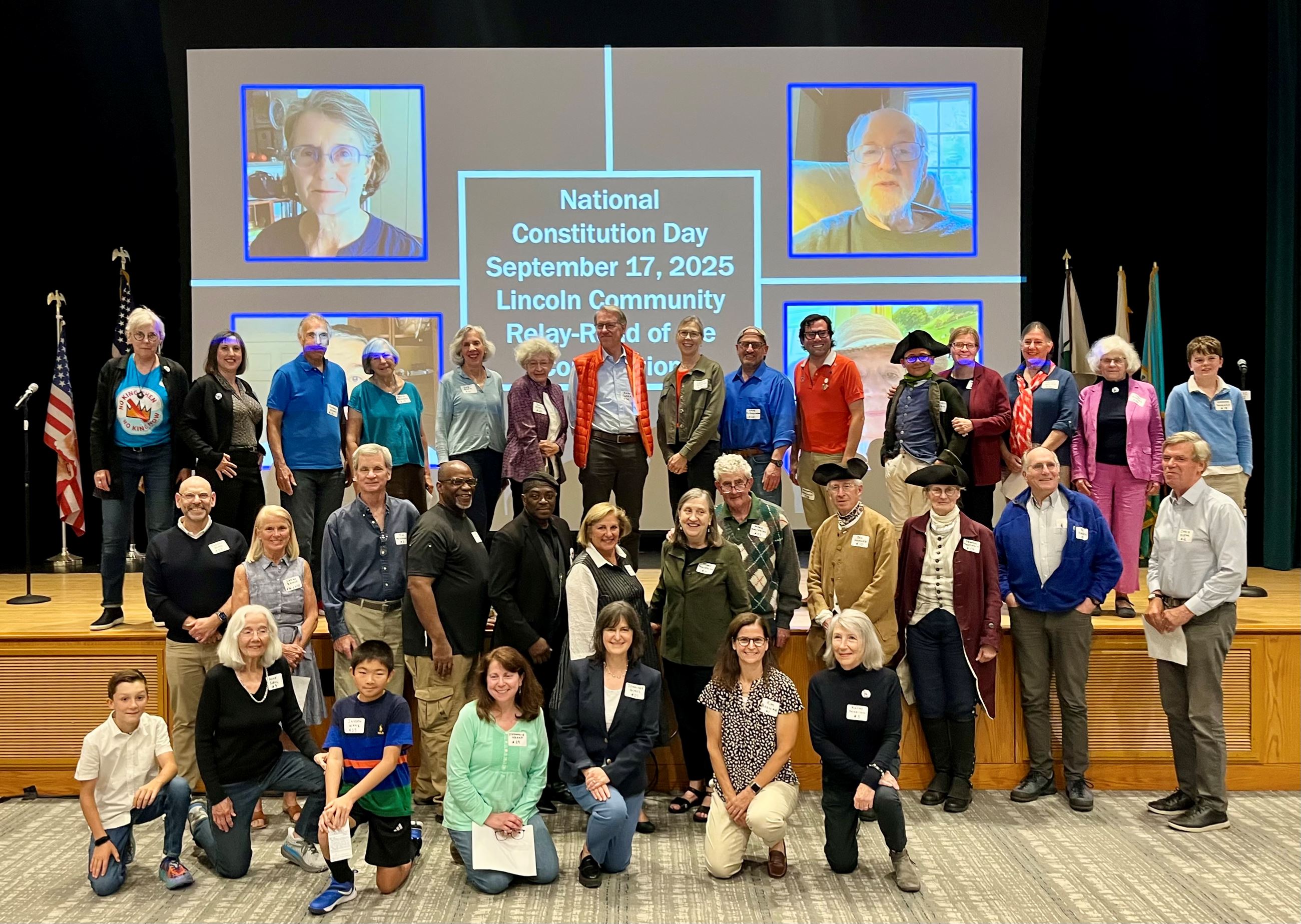 Community members come together to read the Constitution.