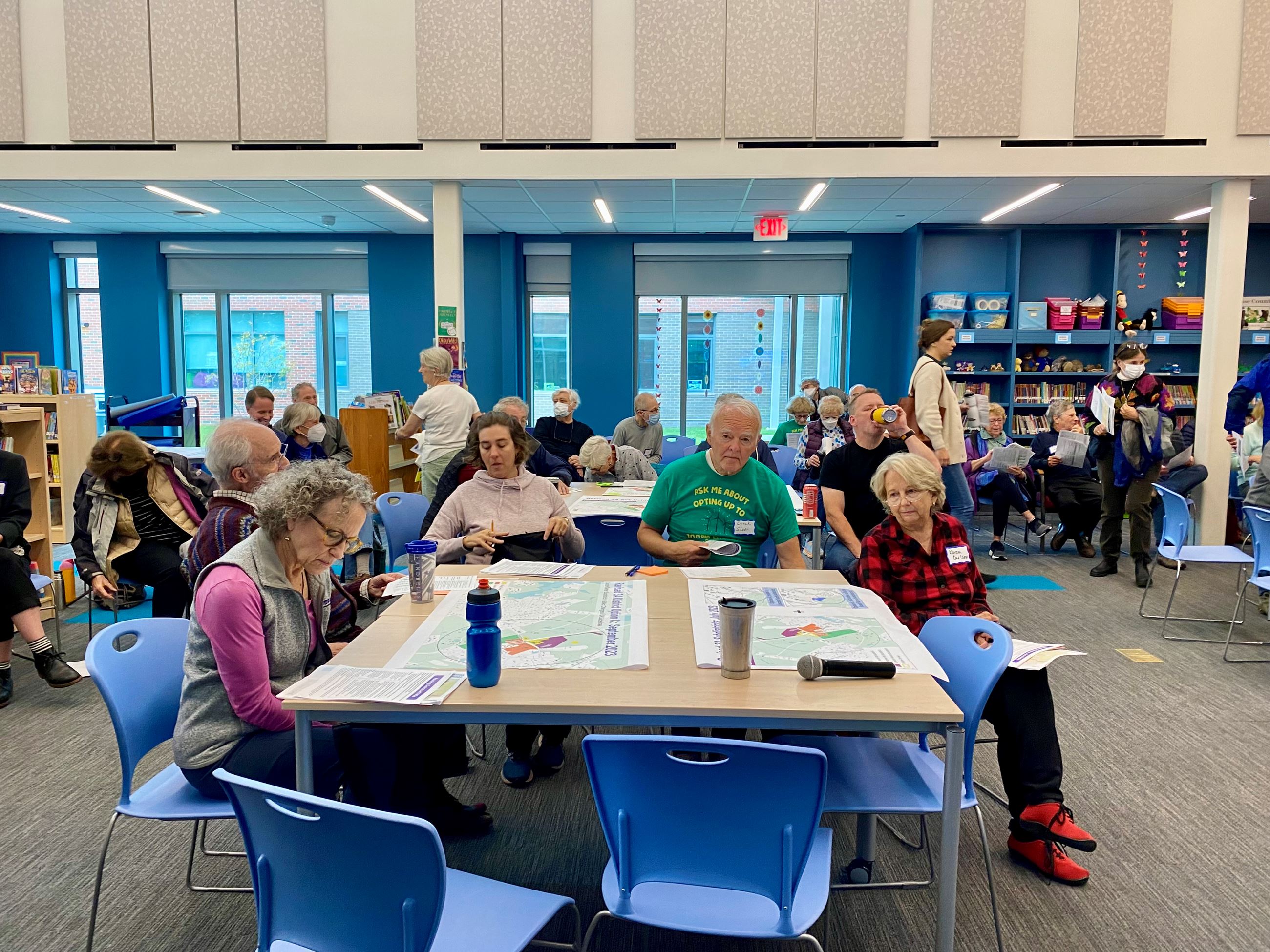 Participants listen to the presentation.